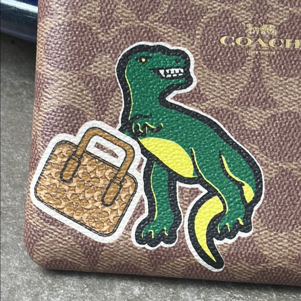 Coach Brown Wristlet with Dinosaur and Strawberry Patches - Picture 7 of 13